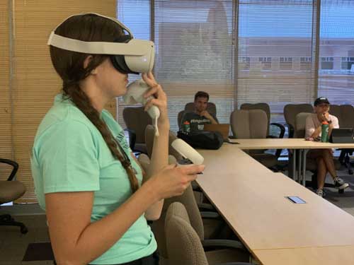 MGA graduate student Victoria Horton-Roark uses the VR headset.